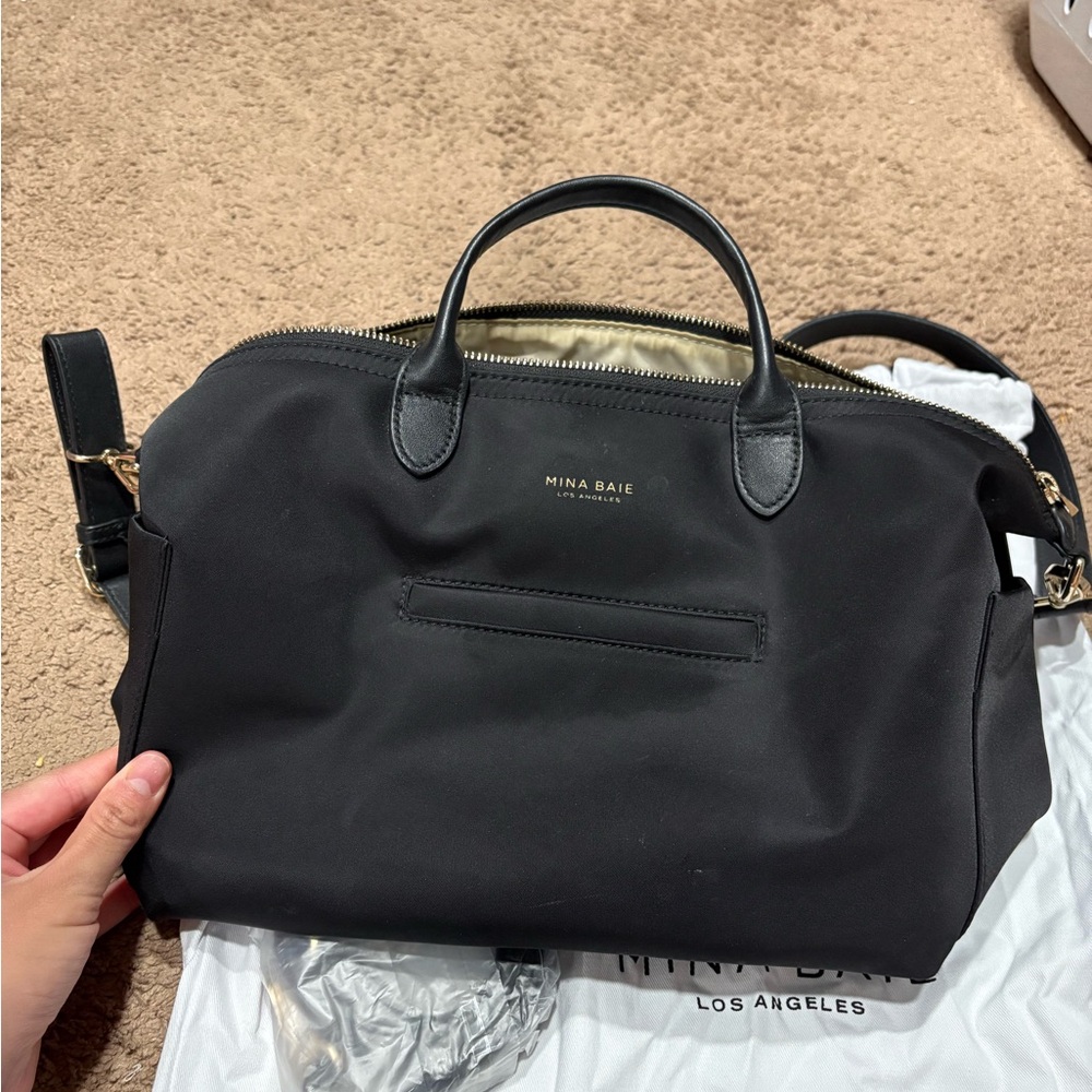 Mini Nina Baie Black Baby Bag


No tears, handle in good condition